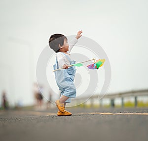 infant baby learning to walking first step on pathway