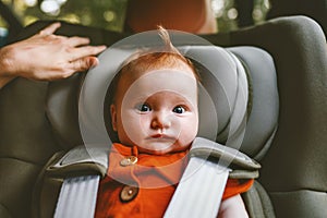 Infant baby sitting in safety car seat child security transportation