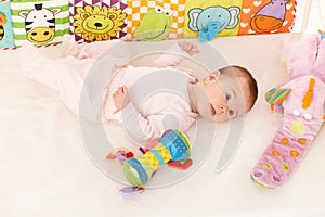 Infant with baby toys