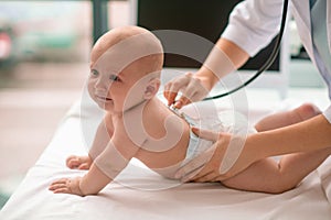 Infant being auscultated with a sterile stethoscope