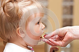 Infant Being Fed by Mother