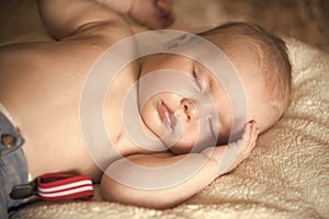 Infant boy sleep on blanket