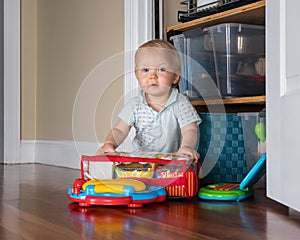 Infant caucasian boy working on two computers at the same time