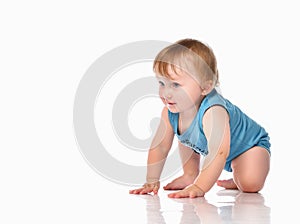 Infant child baby boy crawling and happy looking, isolated on a white background.