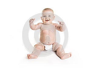 Infant child baby boy toddler in diaper looking at the camera isolated on a white background