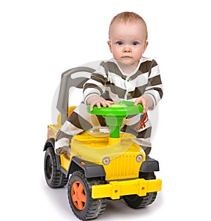 Infant child baby boy toddler happy driving big toy car truck