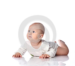 Infant child baby boy toddler lying in white shirt happy smiling isolated on a white