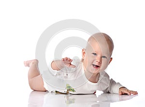 Infant child baby boy toddler lying in white shirt happy smiling isolated on a white