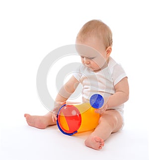 Infant child baby boy toddler playing holding watering can in ha