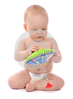 Infant child baby boy toddler playing with whirligig toy