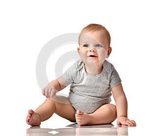 Infant child baby boy toddler sitting in grey body