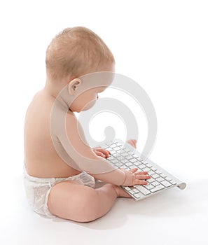 Infant child baby boy toddler typing computer keyboard