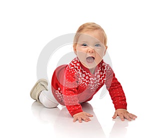 Infant child baby girl crawling in red sweater yelling laughing