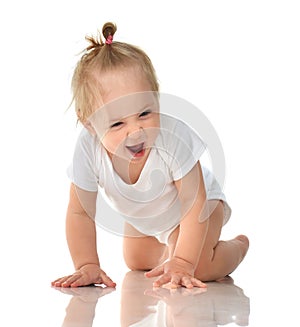 Infant child baby girl in diaper crawling happy laughing smiling