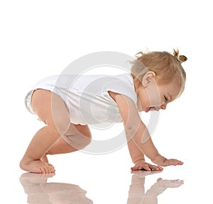 Infant child baby girl in diaper crawling happy laughing smiling