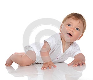 Infant child baby girl in diaper lying happy smiling and looking