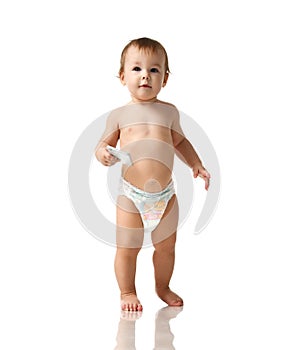 Infant child baby girl kid toddler in diaper make first steps with mobile cellphone isolated on a white