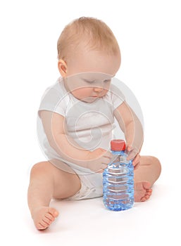 Infant child baby girl sitting with big bottle of drinking water
