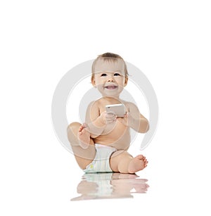 Infant child baby girl toddler playing with mobile cellphone happy smiling