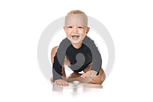 Infant child baby toddler crawling happy looking straight isolated on a white background