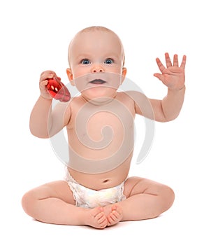 Infant child baby toddler holding red heart valentines