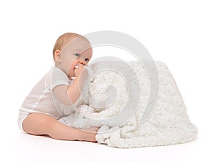 Infant child baby toddler sitting and eating soft blanket towel