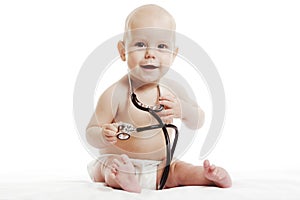 Infant child baby toddler sitting with medical stethoscope for physical therapy test isolated on a white background