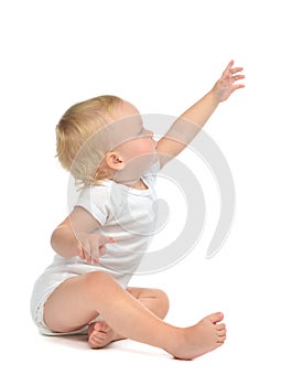 Infant child baby toddler sitting raise hand up pointing finger