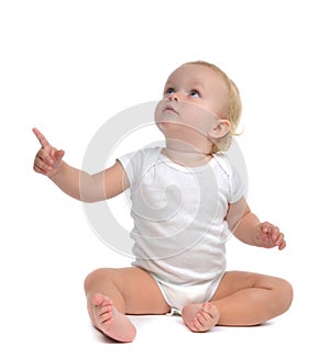 Infant child baby toddler sitting raise hand up pointing finger