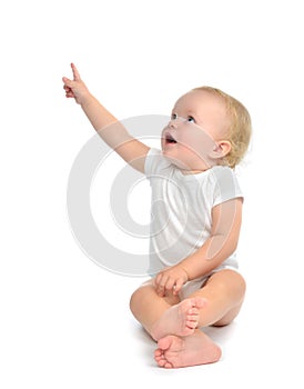 Infant child baby toddler sitting raise hand up pointing finger