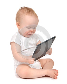 Infant child baby toddler sitting and typing digital tablet mobi