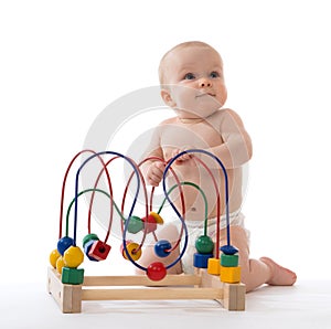 Infant child baby toddler standing and playing wooden educational toy