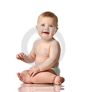 Infant child boy toddler in diaper sitting happy smiling