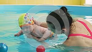 Infant Child Diving into the Paddling Pool
