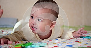 infant, childhood concept - close-up of crying Baby plays with a teether. Teeth cutting. First teeth. Joy toothless 7