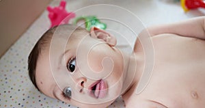 infant, childhood concept - close-up of smiling happy Baby plays with a teether. Teeth cutting. First teeth. Joy