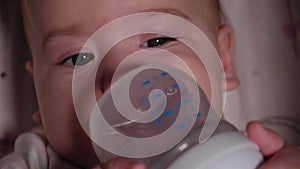 Infant, childhood, emotion concept - Extreme close-up of smiling face of brown-eyed newborn awake toothless baby 7