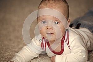 Infant crawl on floor carpet