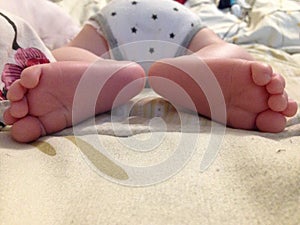 infant heelpiece. two children& x27;s heels in different directions, the first photos newborn