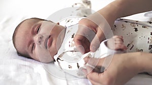Infant, motherhood, development, childhood, training, paediatrics, medicine and health concept - close-up newborn