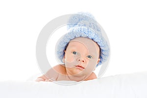 Infant wearing blue knit hat