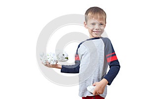 Infatuated child boy playing plastic toy lizard robot with a remote control, isolated on white background. The nano-toy Chameleon photo