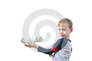 Infatuated child boy playing plastic toy lizard robot with a remote control, isolated on white background. The nano-toy Chameleon photo