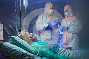 Infected patient in quarantine lying in bed in hospital, coronavirus concept.