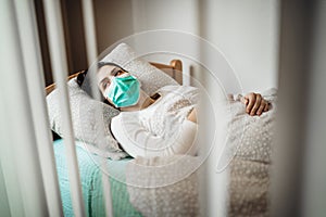 Infected woman with mask in mobile quarantine hospital units isolation.Coronavirus patient having pneumonia disease symptoms.