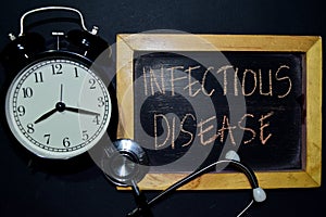 Infectious Disease handwriting on chalkboard on top view