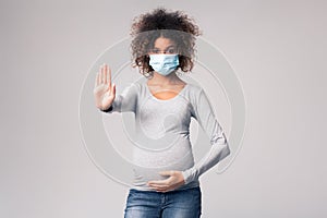 Infectious diseases and flu. Pregnant lady in medical mask