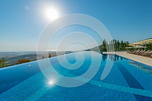 Infinity pool on the bright summer day