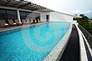 Infinity pool design, roof top of resort hotel