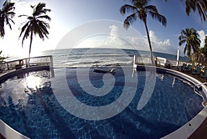 Infinity pool with float caribbean sea